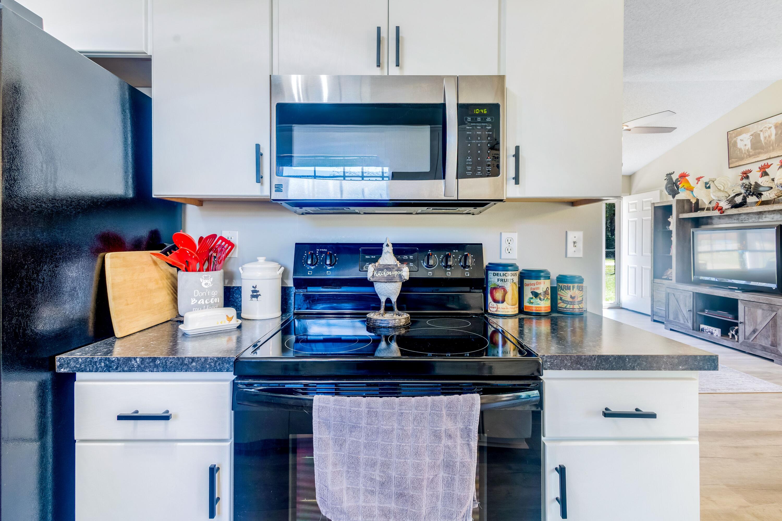 103 Valley View Drive DeFuniak Springs, FL 32433 - Photo 16 of 34 a kitchen with stainless steel appliances granite countertop a stove and cabinets