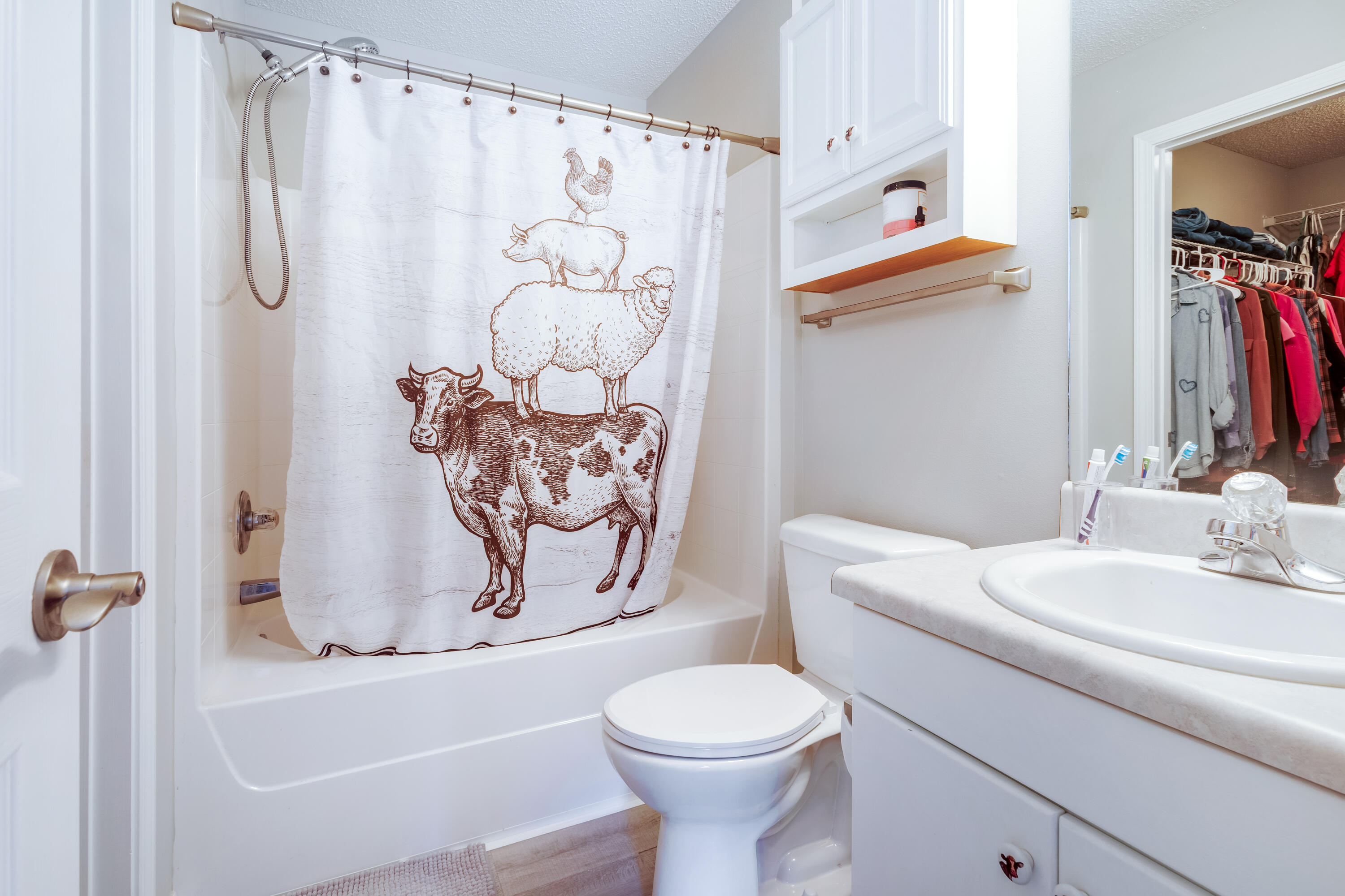 103 Valley View Drive DeFuniak Springs, FL 32433 - Photo 20 of 34 a bathroom with a shower curtain and a sink