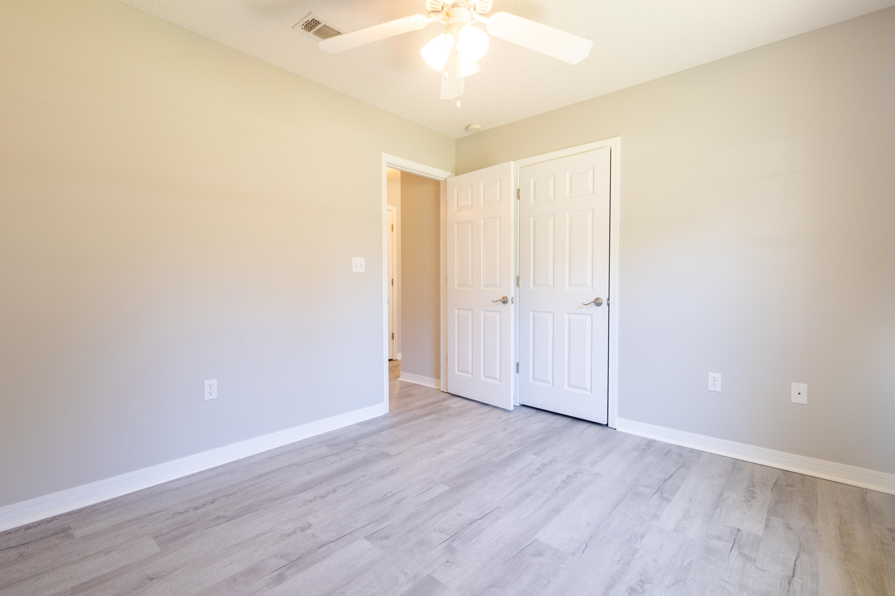 103 Valley View Drive DeFuniak Springs, FL 32433 - Photo 25 of 34 a view of an empty room with wooden floor