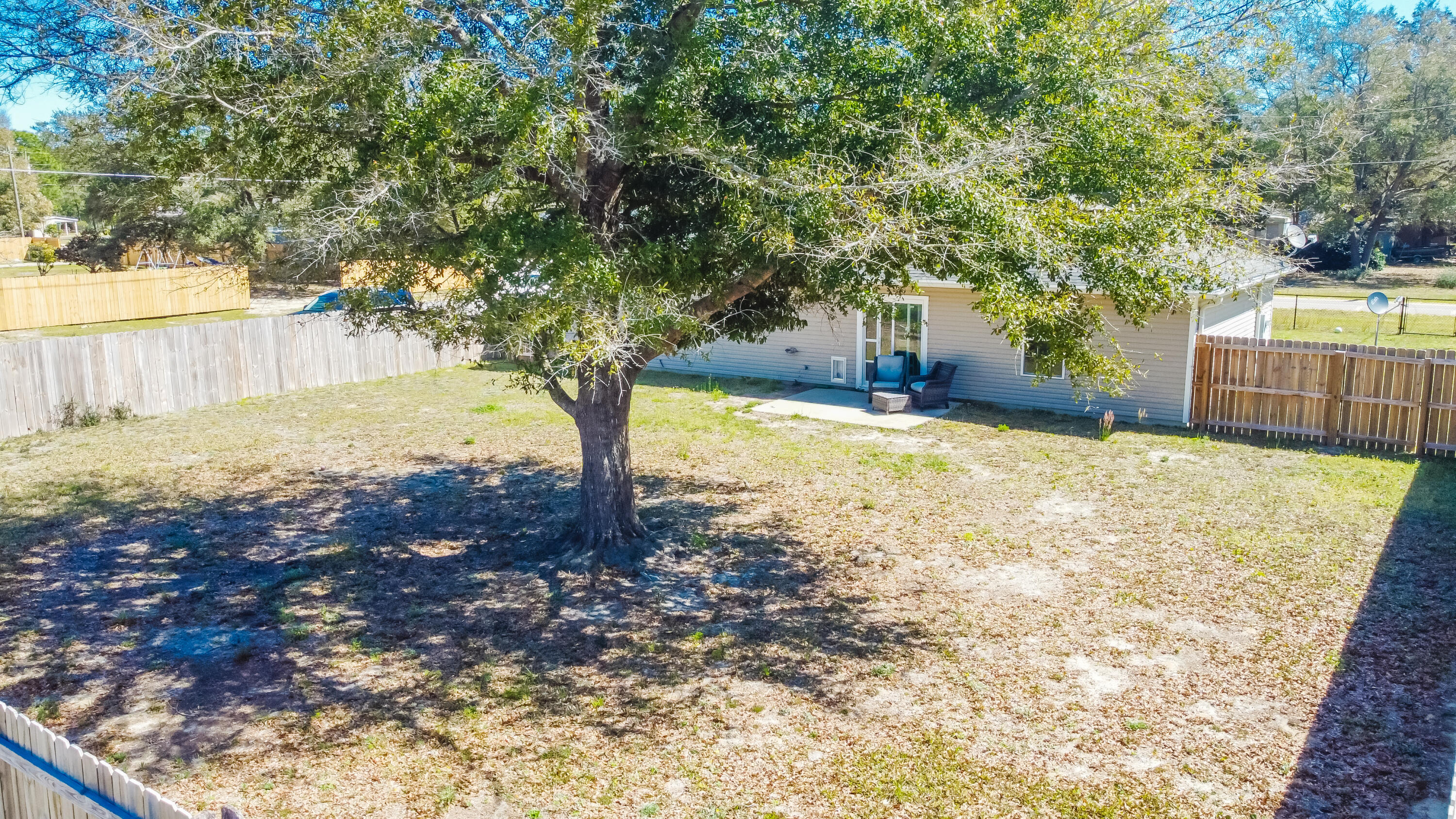 103 Valley View Drive DeFuniak Springs, FL 32433 - Photo 32 of 34 a view of a yard with plants and trees