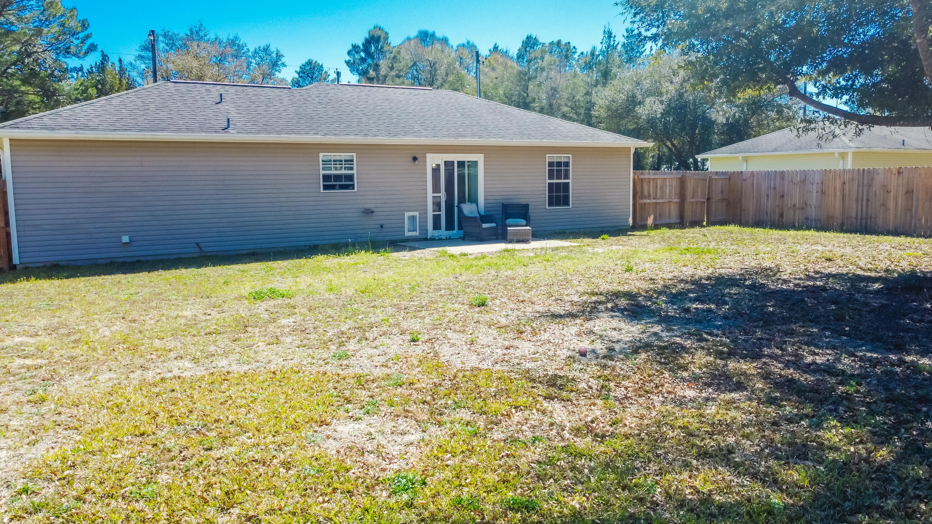 103 Valley View Drive DeFuniak Springs, FL 32433 - Photo 33 of 34 a view of a house with a yard and a large tree
