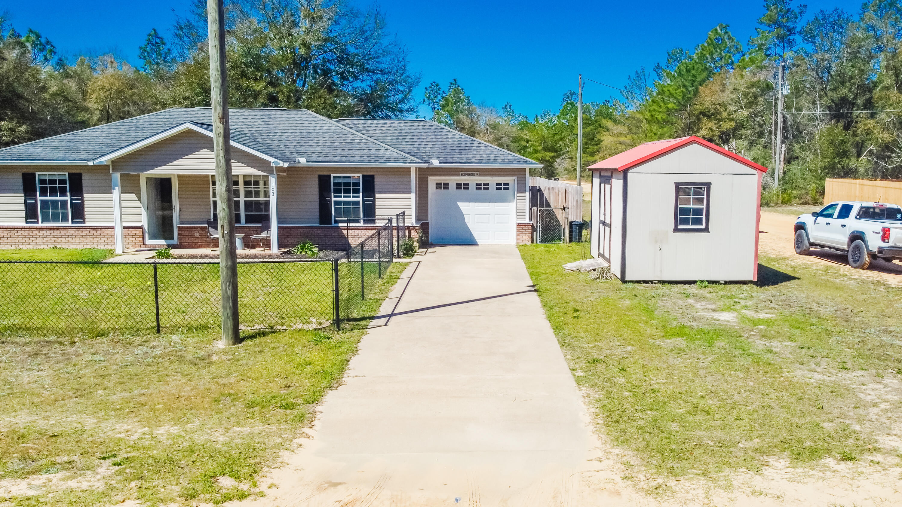 103 Valley View Drive DeFuniak Springs, FL 32433 - Photo 5 of 34 a front view of a house with swimming pool