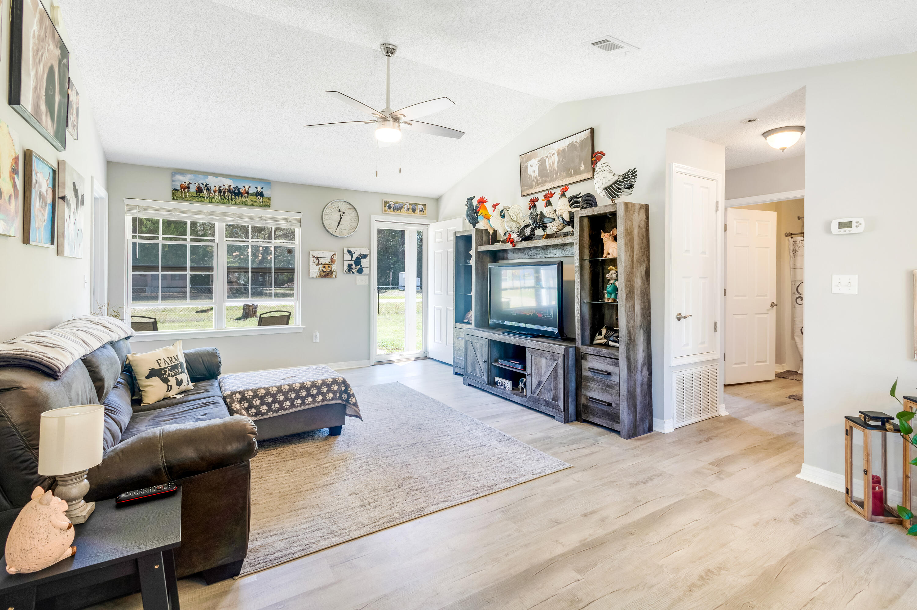 103 Valley View Drive DeFuniak Springs, FL 32433 - Photo 10 of 34 a living room with furniture and a flat screen tv