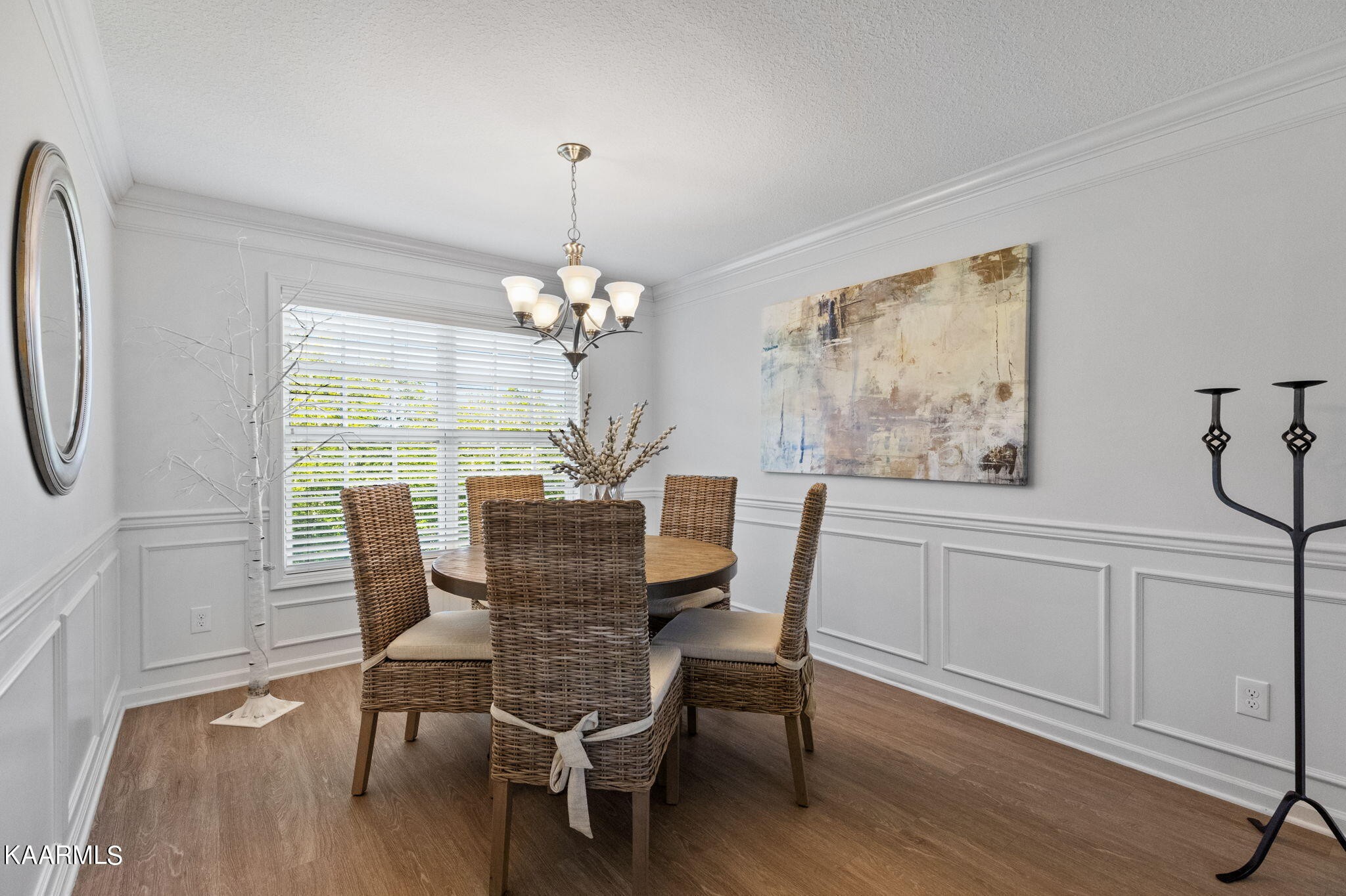 1825 Turning Point Road Powell, TN 37849 - Photo 15 of 40 a dining room with furniture a chandelier and wooden floor