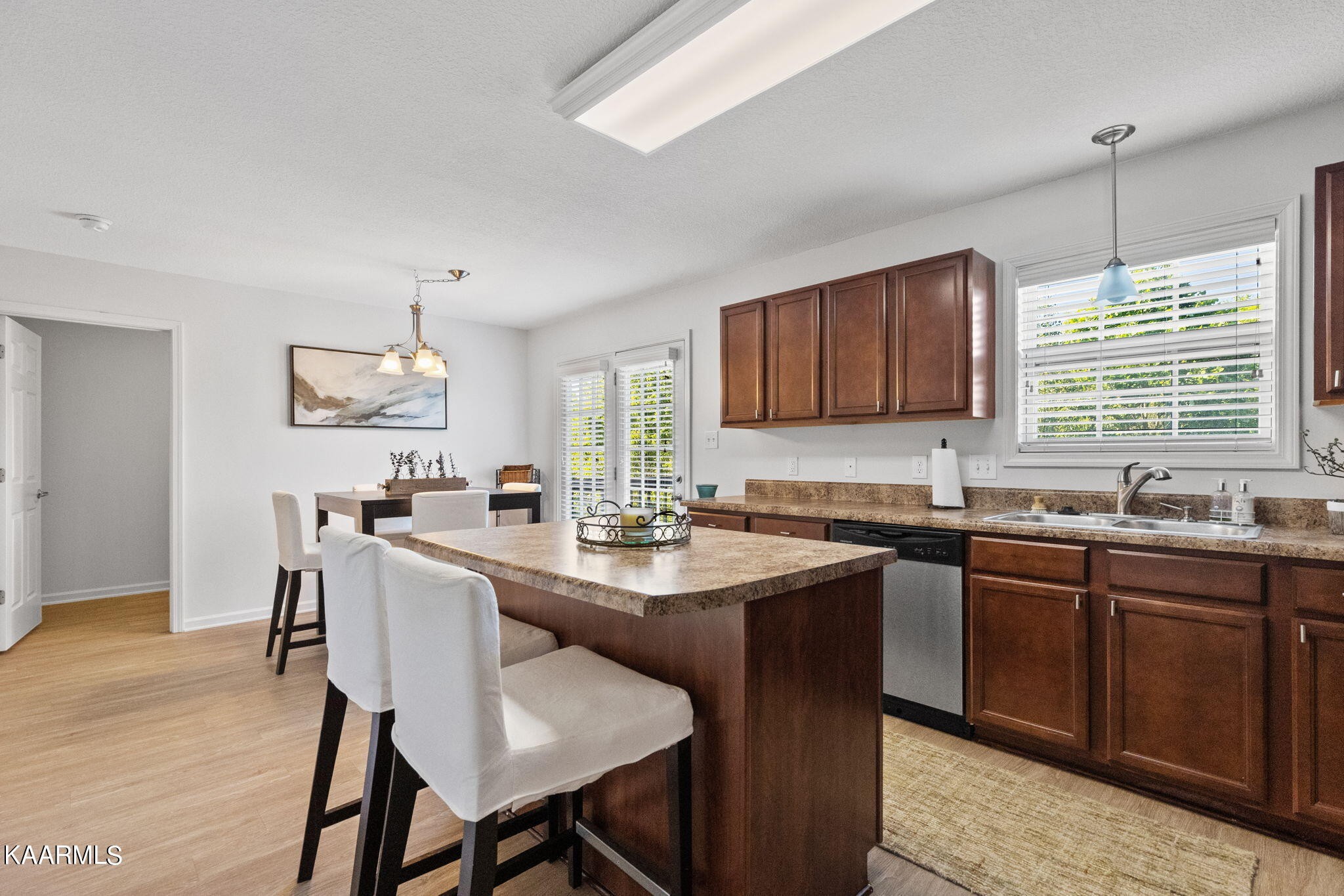 1825 Turning Point Road Powell, TN 37849 - Photo 17 of 40 a kitchen with granite countertop a sink stove and cabinets