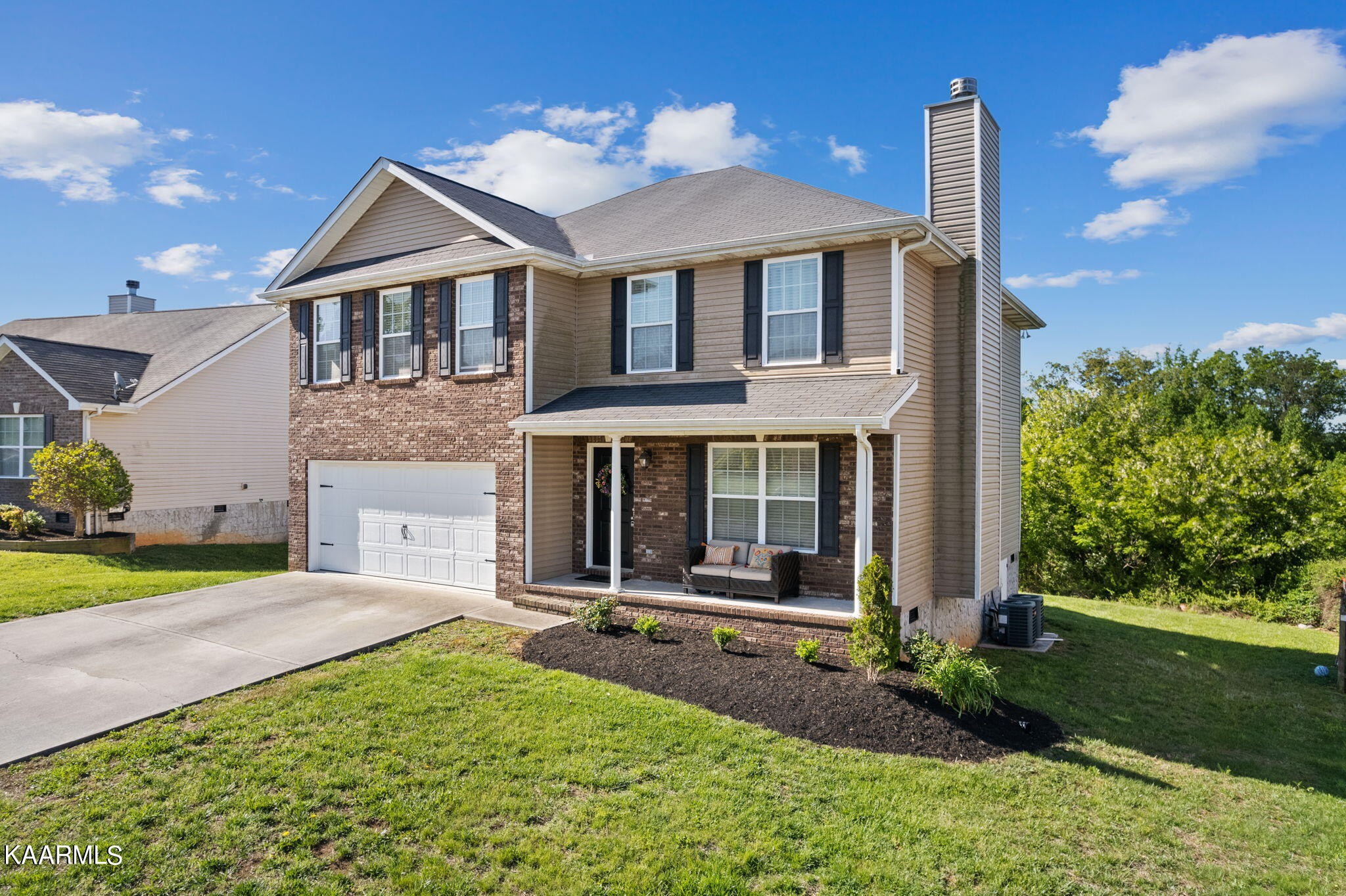 1825 Turning Point Road Powell, TN 37849 - Photo 2 of 40 a front view of a house with garden