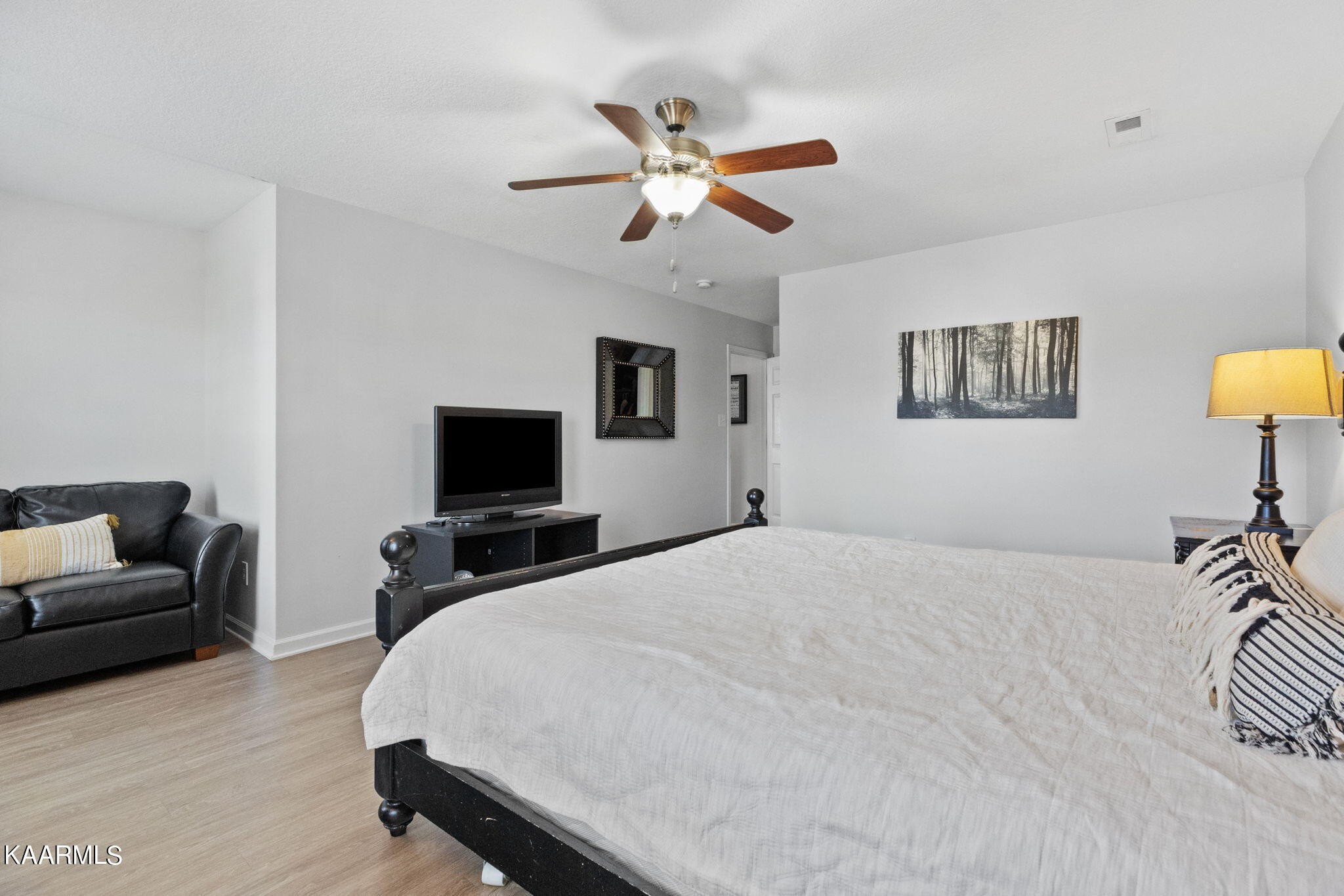 1825 Turning Point Road Powell, TN 37849 - Photo 24 of 40 a bedroom with a bed and a couch