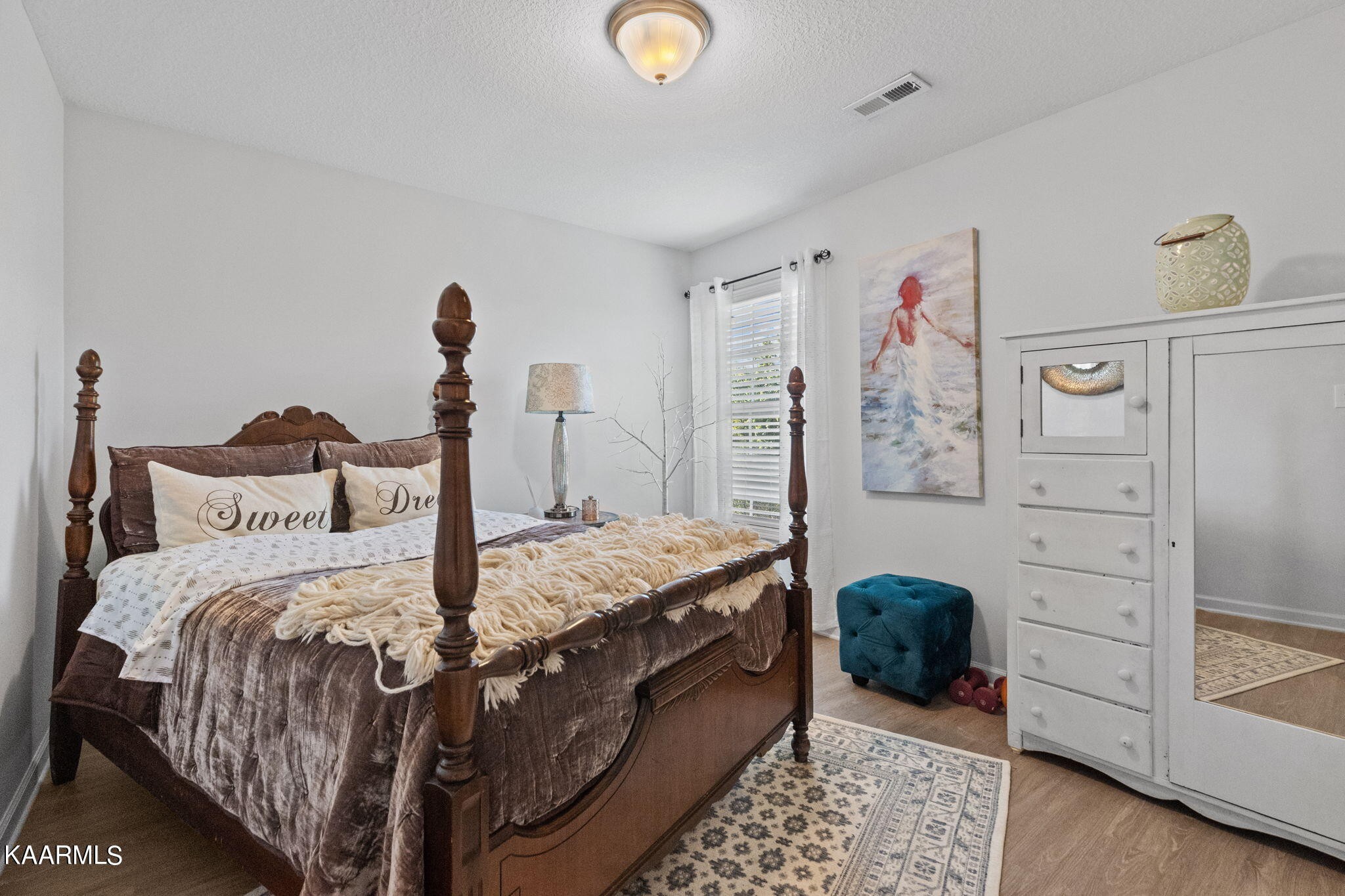 1825 Turning Point Road Powell, TN 37849 - Photo 27 of 40 a bedroom with a bed and a dresser