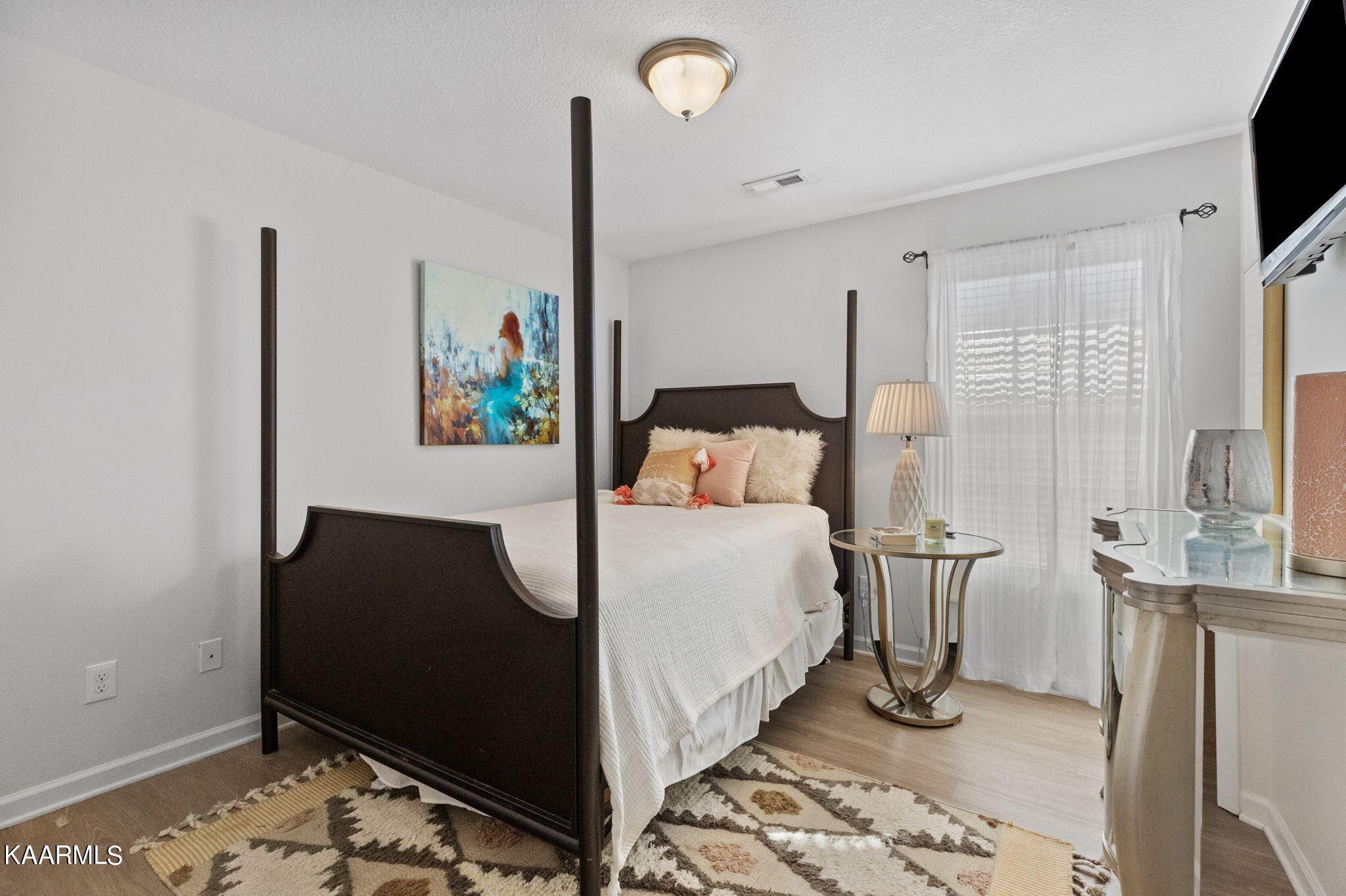 1825 Turning Point Road Powell, TN 37849 - Photo 30 of 40 a bedroom with a bed and a flat screen tv