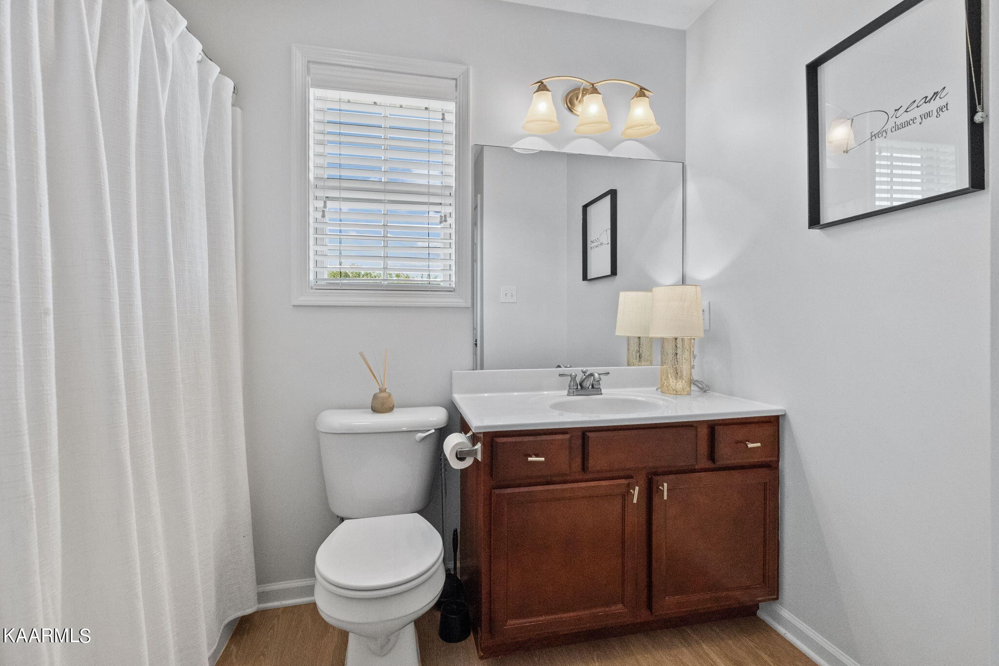 1825 Turning Point Road Powell, TN 37849 - Photo 31 of 40 a bathroom with a toilet a sink and mirror