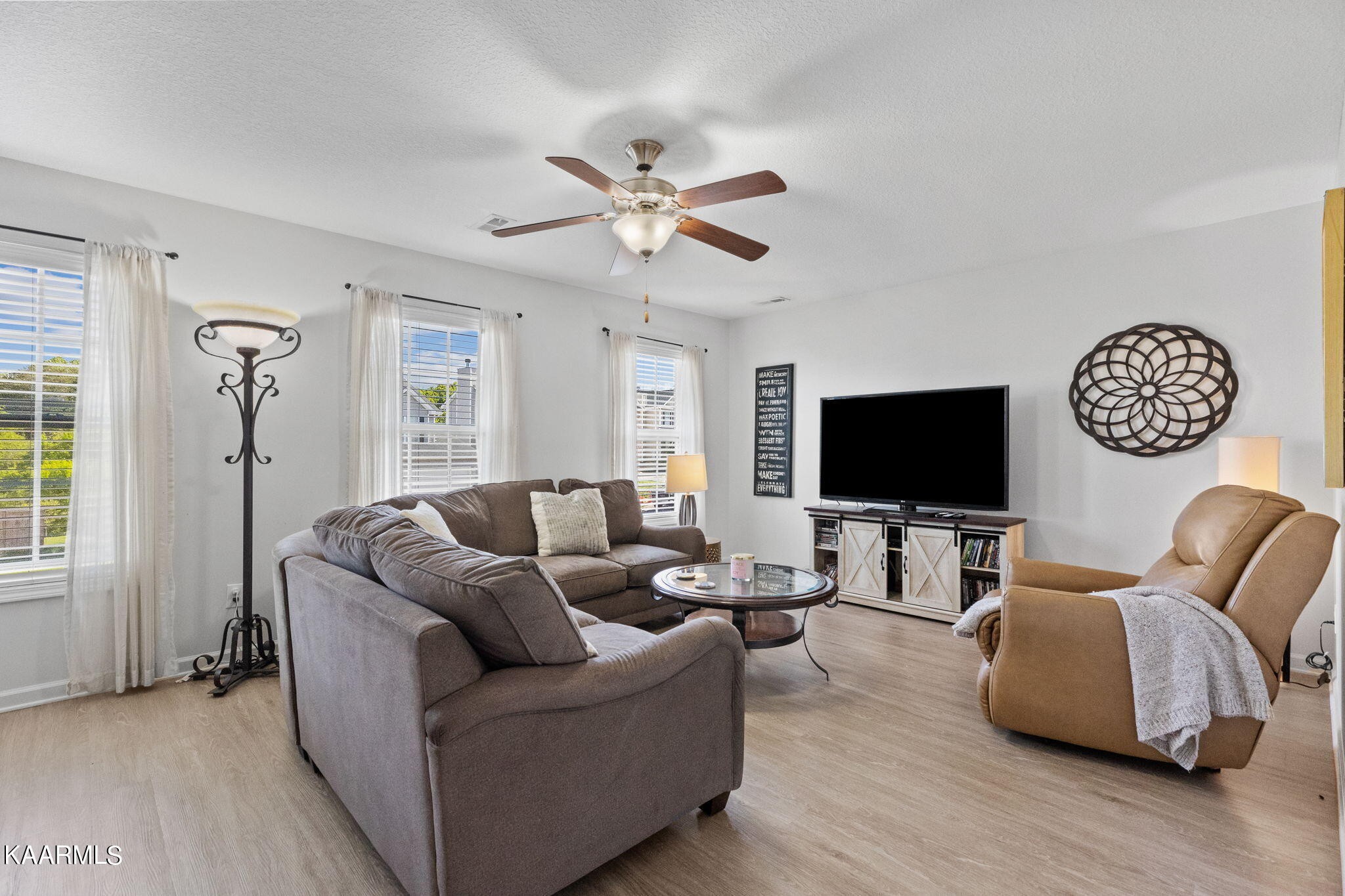 1825 Turning Point Road Powell, TN 37849 - Photo 34 of 40 a living room with furniture and a flat screen tv