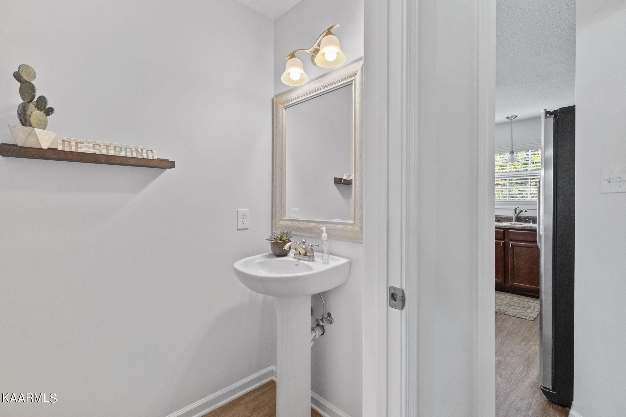 1825 Turning Point Road Powell, TN 37849 - Photo 35 of 40 a bathroom with a sink and a mirror