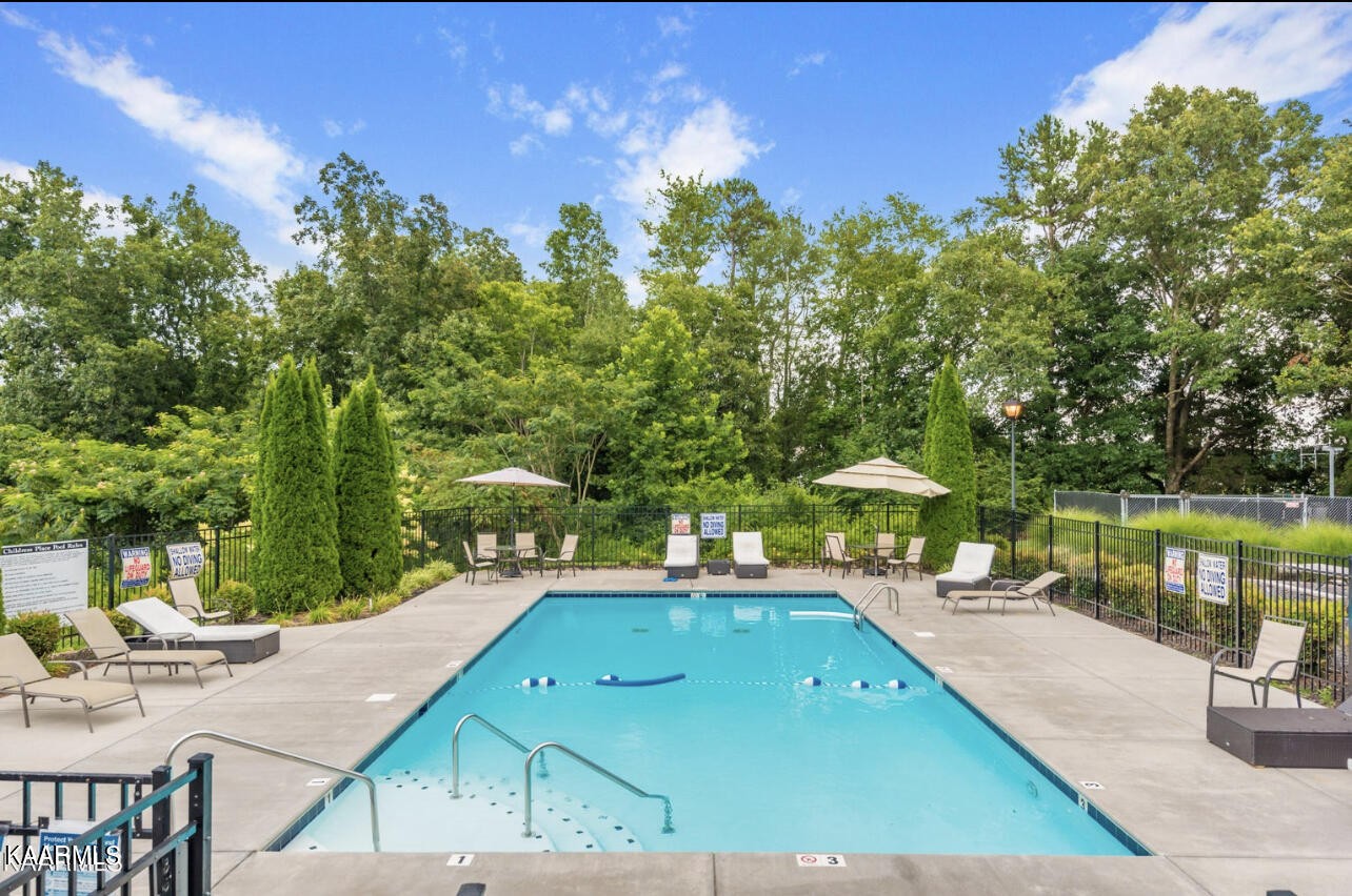 1825 Turning Point Road Powell, TN 37849 - Photo 8 of 40 a view of a swimming pool with a patio