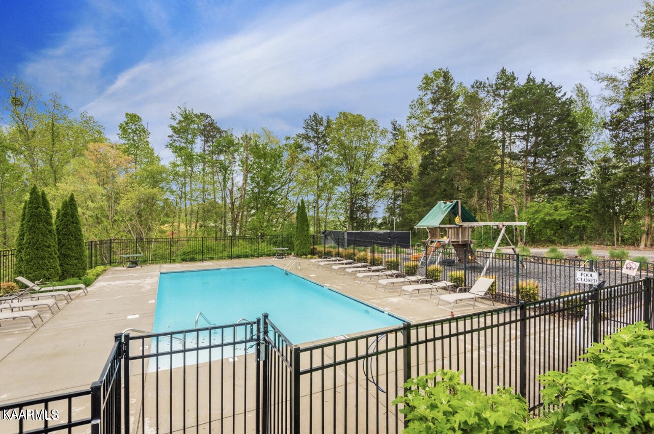 1825 Turning Point Road Powell, TN 37849 - Photo 9 of 40 a view of a swimming pool with a patio