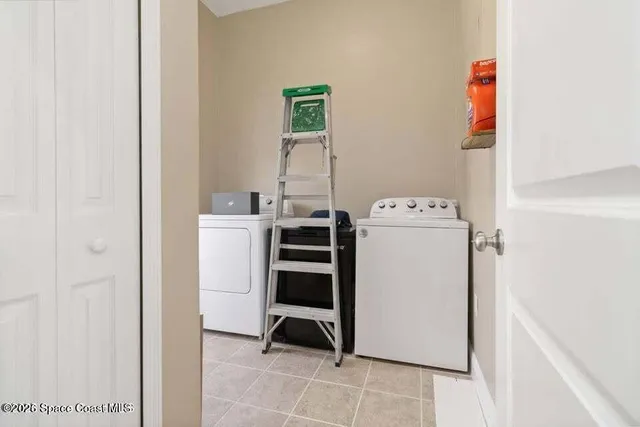 a utility room with dryer and washer
