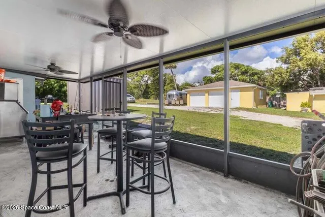 a view of an outdoor dining space with furniture