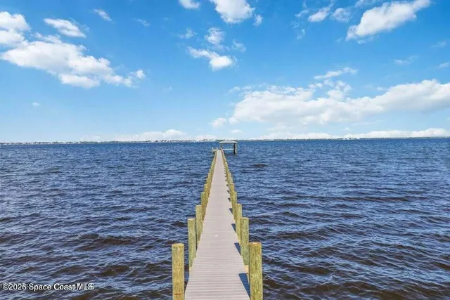 a balcony with view of the ocean