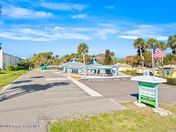a view of a swimming pool with an outdoor seating