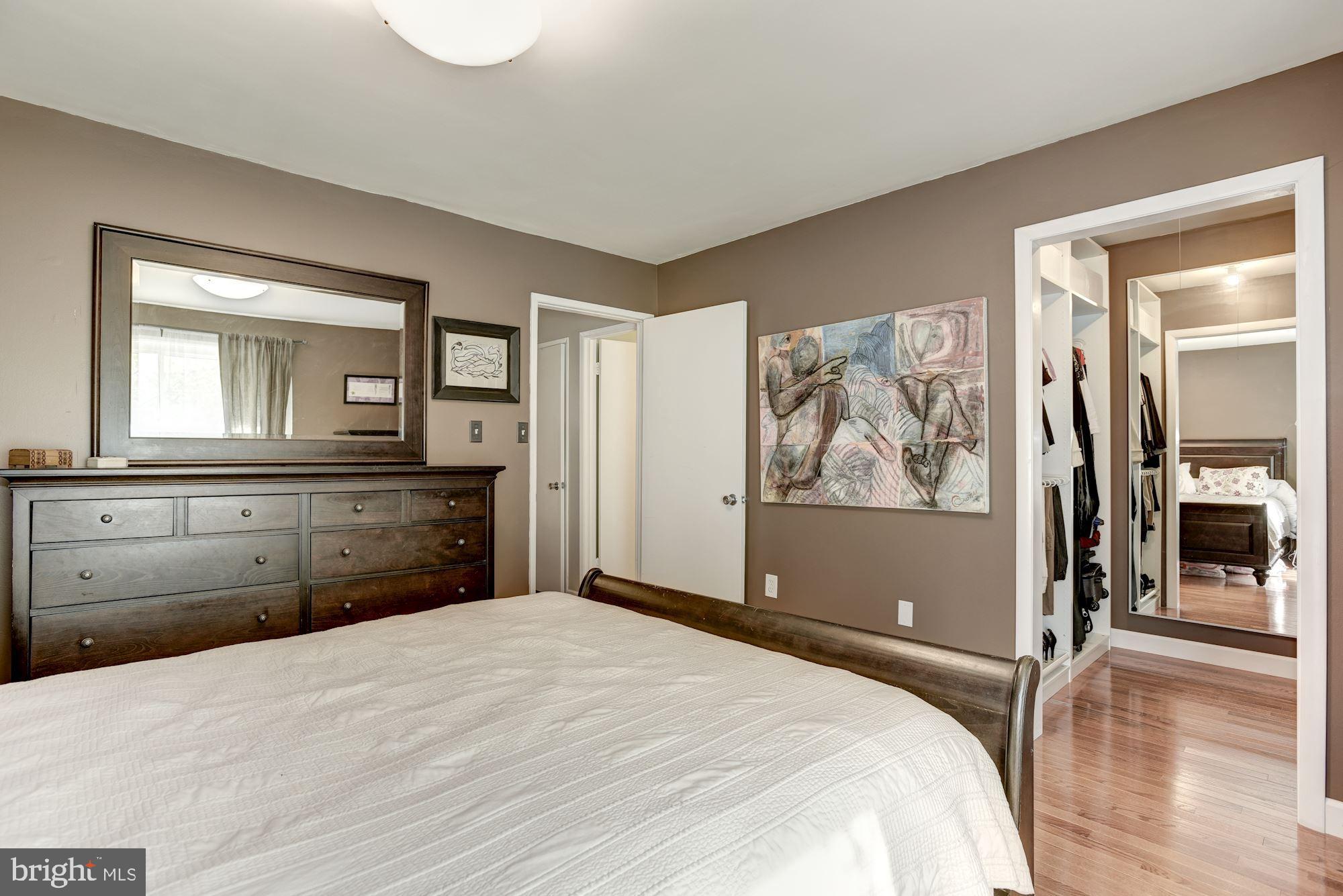 2220 Cartwright Place Reston, VA 20191 - Photo 15 of 39 Master Bedroom with Walk-in Custom Built-in Closet
