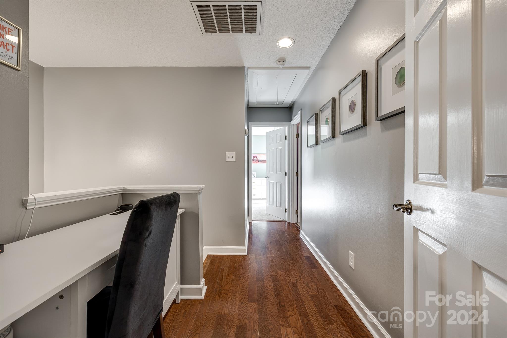 414 West 9th Street, Unit F Charlotte, NC 28202 - Photo 17 of 31 a view of a hallway with entryway and wooden floor