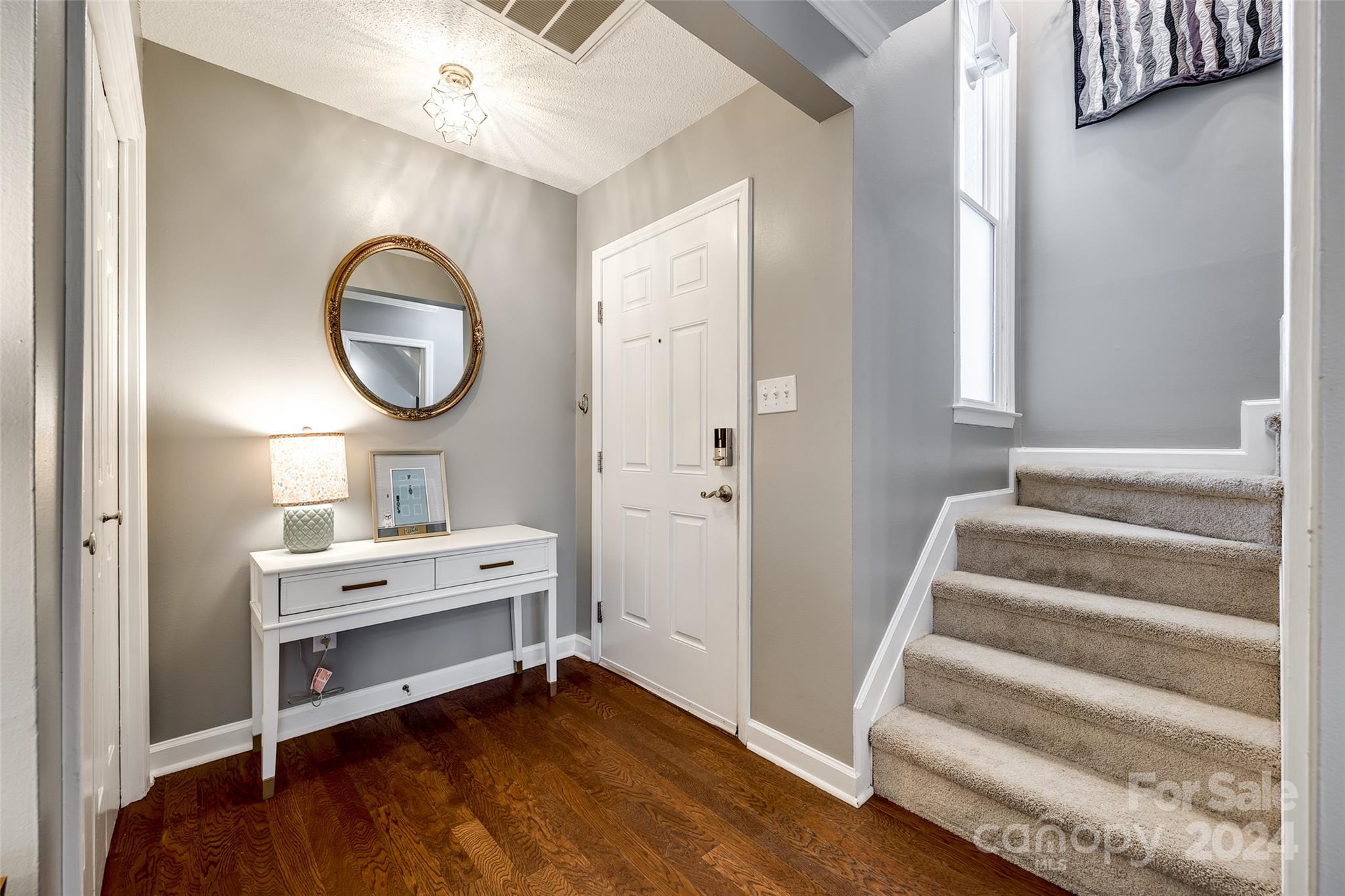 414 West 9th Street, Unit F Charlotte, NC 28202 - Photo 5 of 31 a view of a hallway to rooms and wooden floor