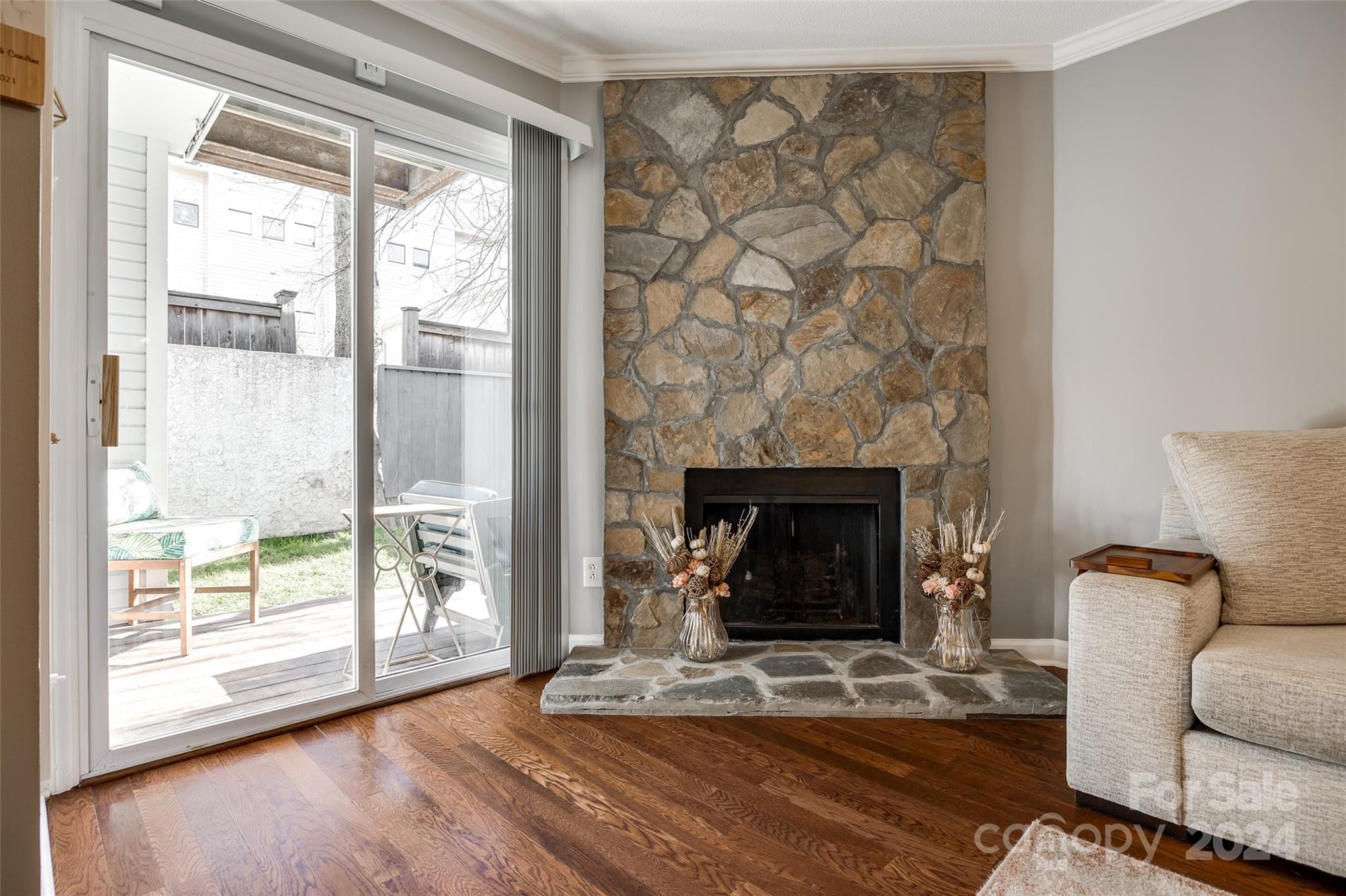 414 West 9th Street, Unit F Charlotte, NC 28202 - Photo 7 of 31 a living room with a fireplace and a floor to ceiling window