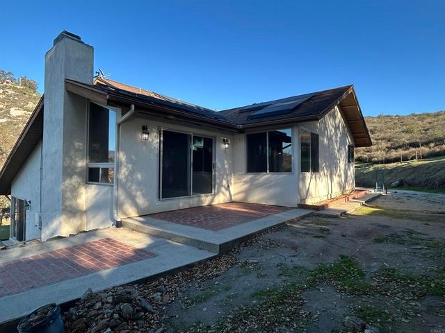 a view of an house with backyard space