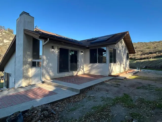 a view of an house with backyard space