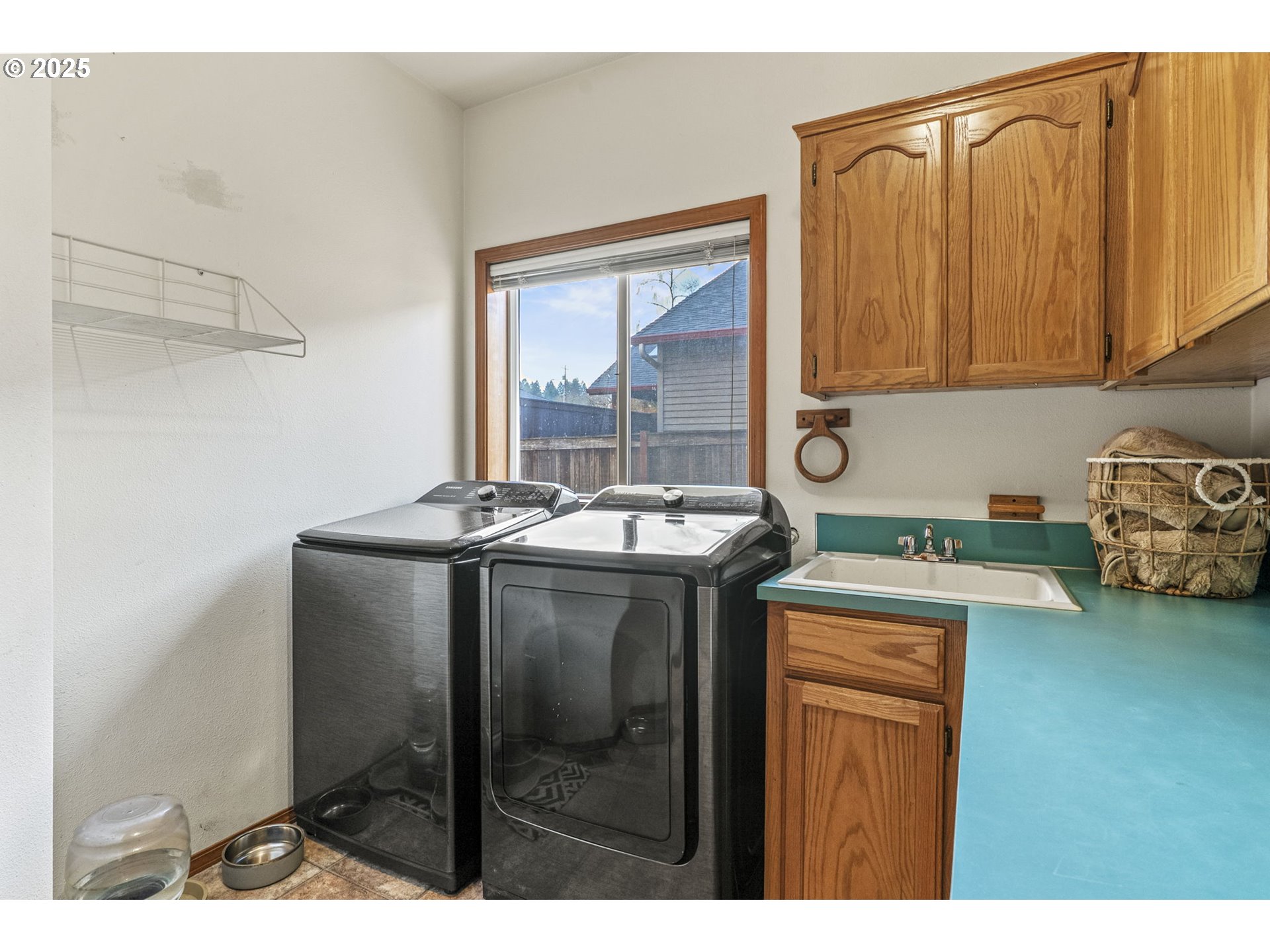 32898 Southwest Keys Landing Way Scappoose, OR 97056 - Photo 18 of 29 a kitchen with a sink cabinets and window
