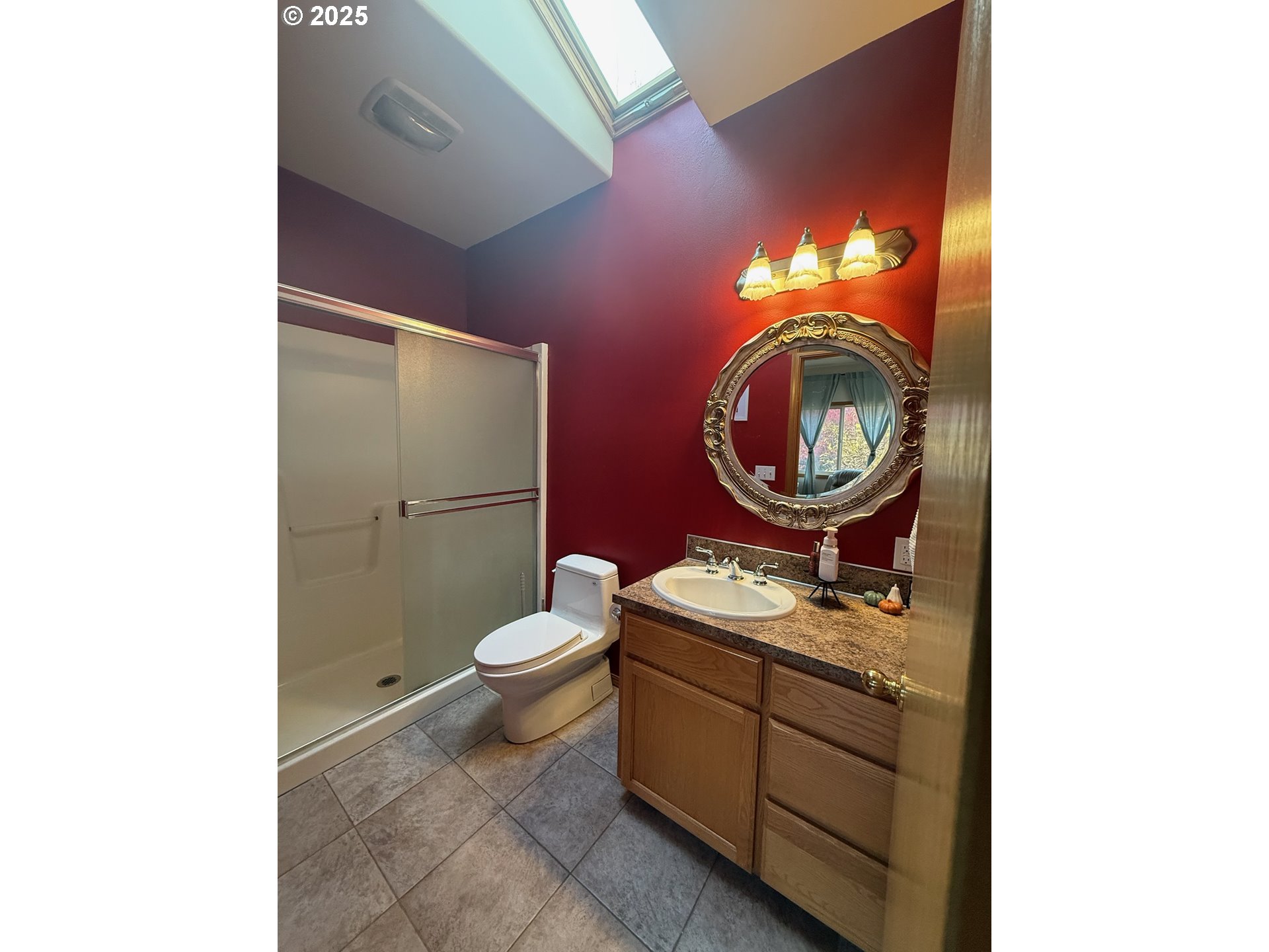 32898 Southwest Keys Landing Way Scappoose, OR 97056 - Photo 26 of 29 a bathroom with a toilet a sink and a mirror
