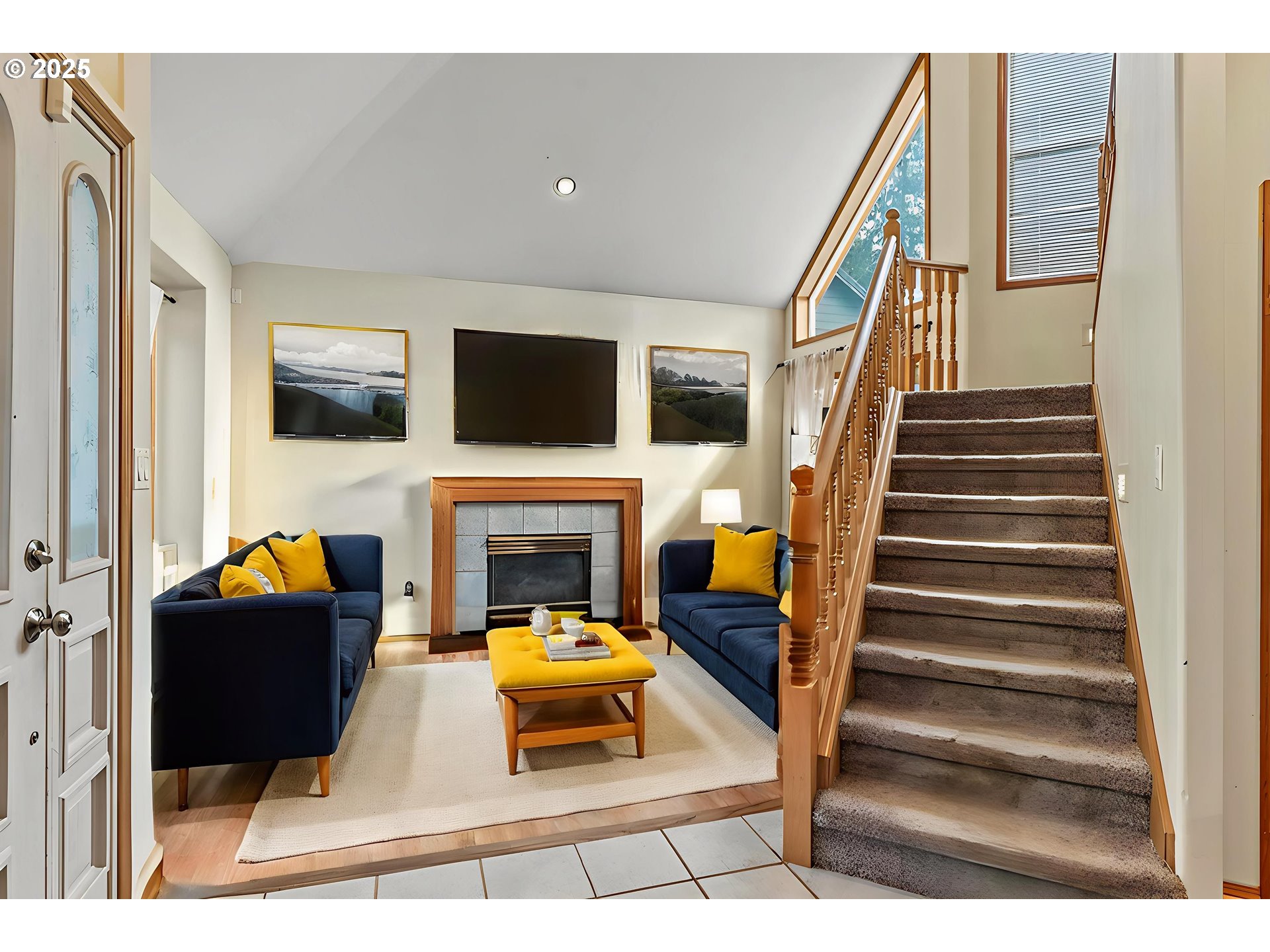 32898 Southwest Keys Landing Way Scappoose, OR 97056 - Photo 5 of 29 a living room with furniture a fireplace and a flat screen tv