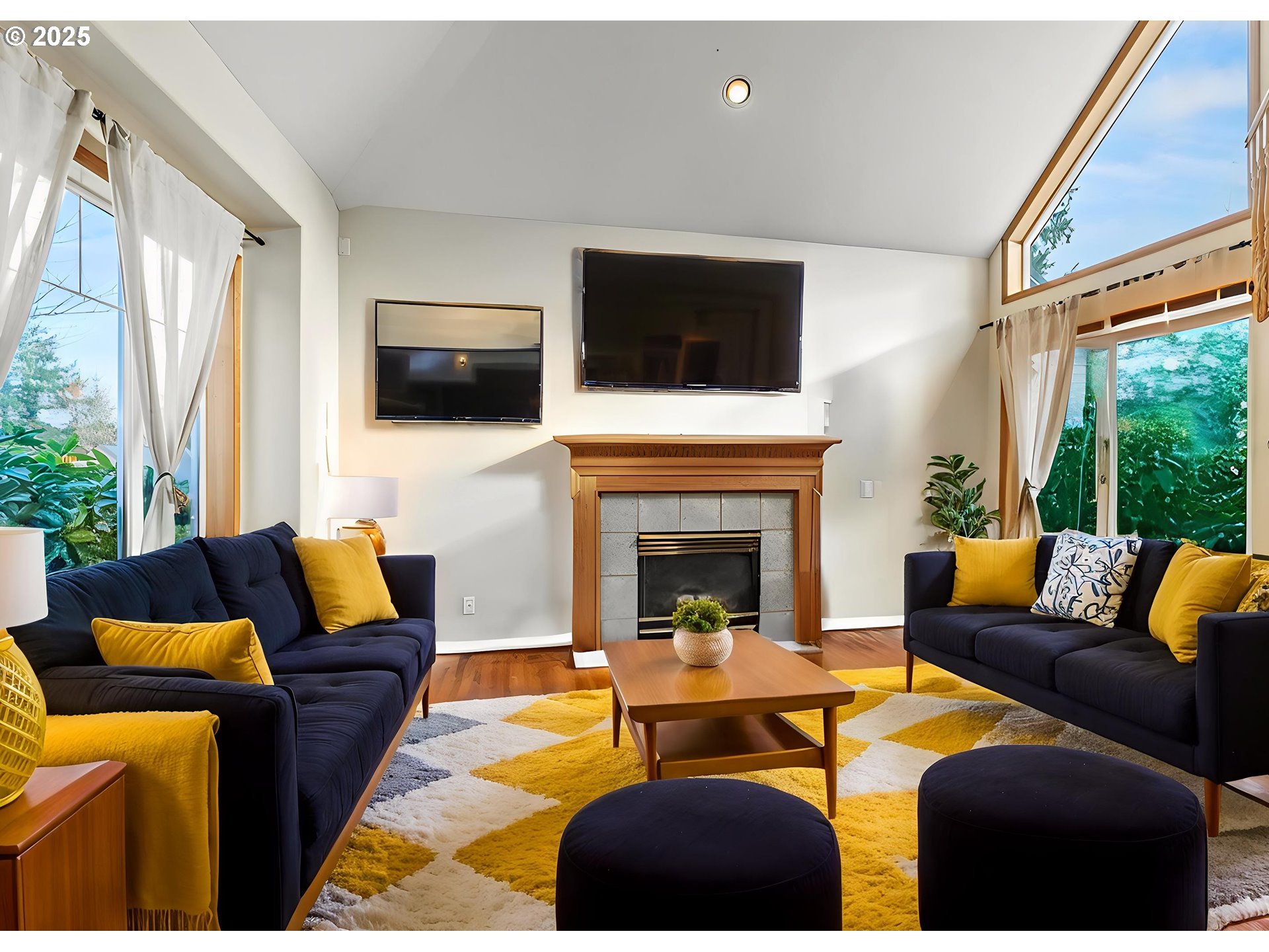 32898 Southwest Keys Landing Way Scappoose, OR 97056 - Photo 6 of 29 a living room with furniture a flat screen tv and a fireplace