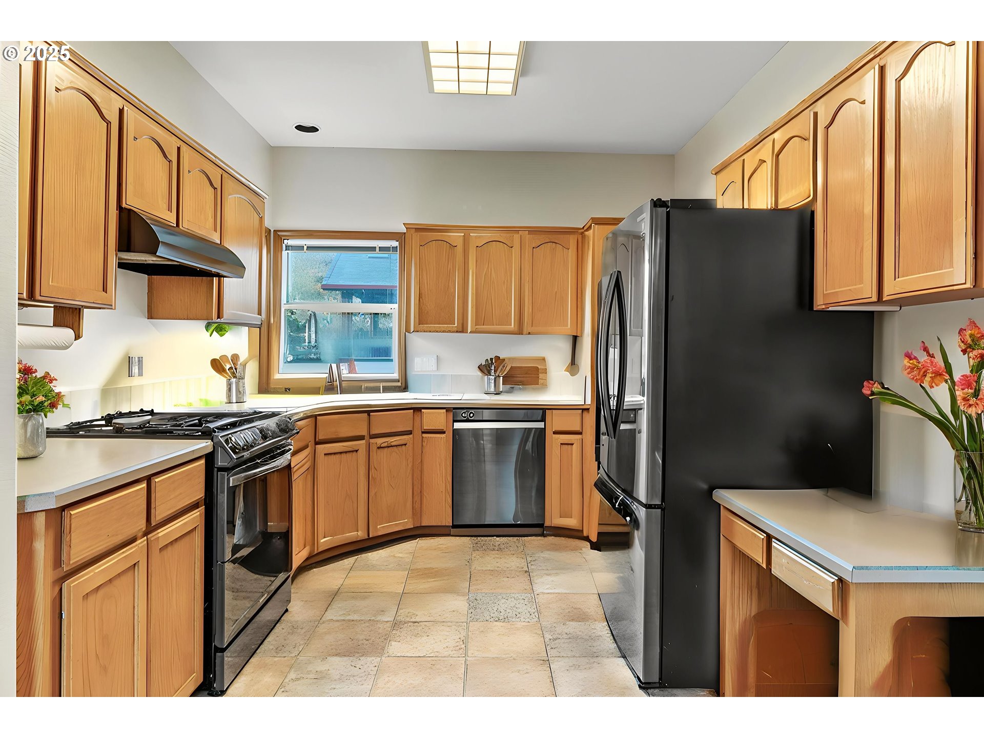 32898 Southwest Keys Landing Way Scappoose, OR 97056 - Photo 10 of 29 a kitchen with a refrigerator sink and stove