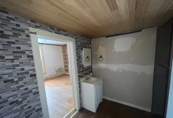 a view of an empty room with a window