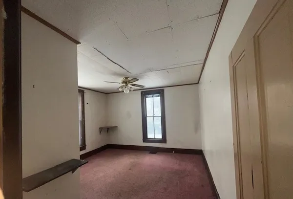 a view of an empty room with a window