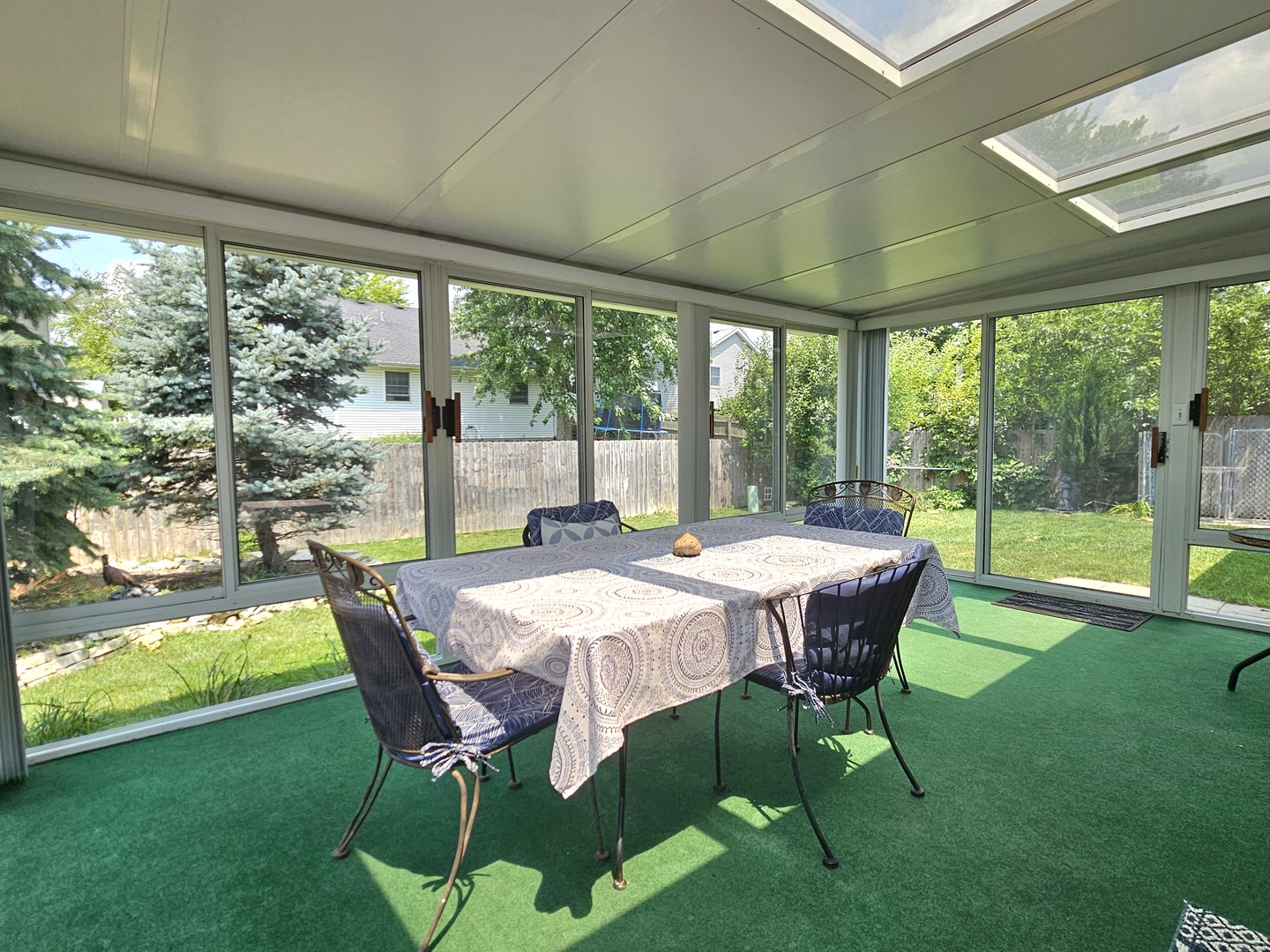 25028 Cashel Bay Road Manhattan, IL 60442 - Photo 7 of 32 a dining room with furniture and garden view