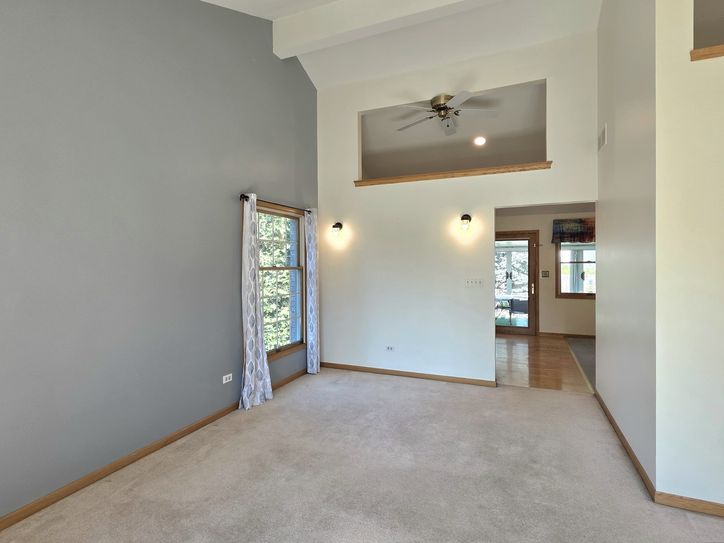 25028 Cashel Bay Road Manhattan, IL 60442 - Photo 10 of 32 a view of an empty room and window and ceiling fan