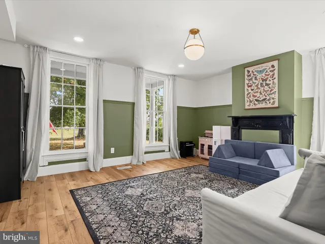 a view of a dining room with furniture and window