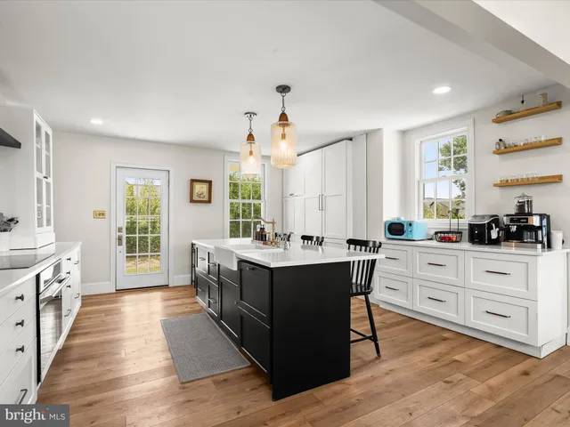 a kitchen with a stove and a refrigerator
