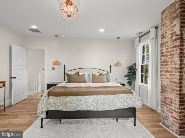 a bathroom with a double vanity sink and mirror