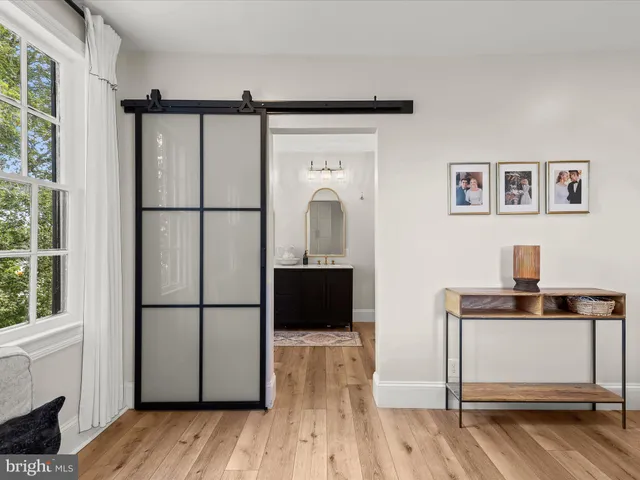 a bedroom with a large bed and a couch