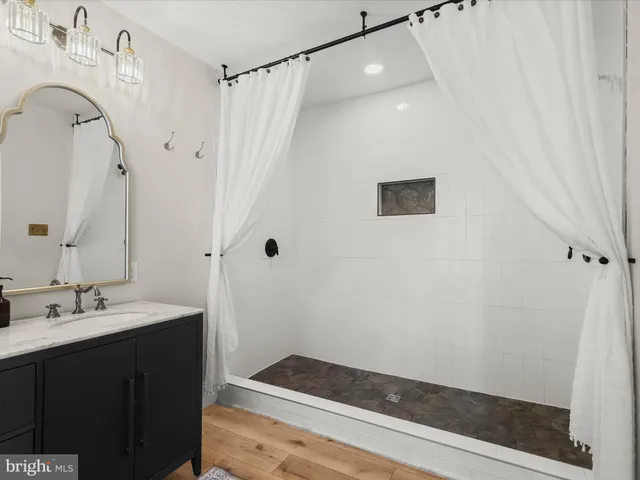 a view of a big house with a big yard and large trees