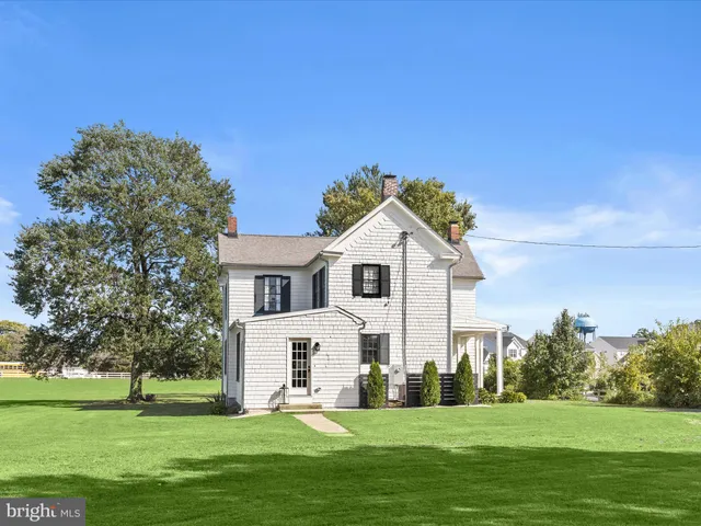 a aerial view of a house with a yard