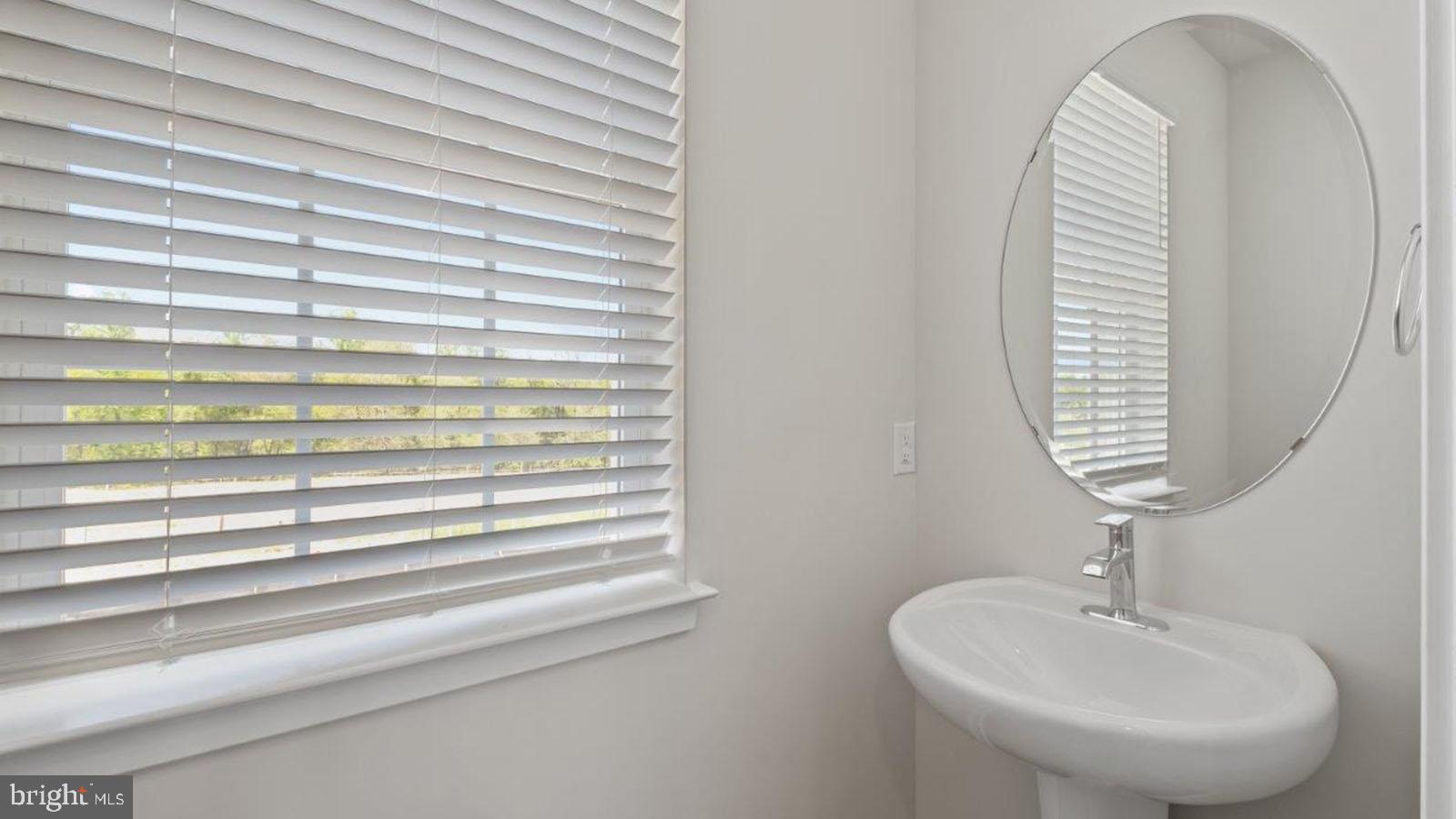 7521 Silver Thread Way Brandywine, MD 20613 - Photo 15 of 39 a bathroom with a sink and a mirror