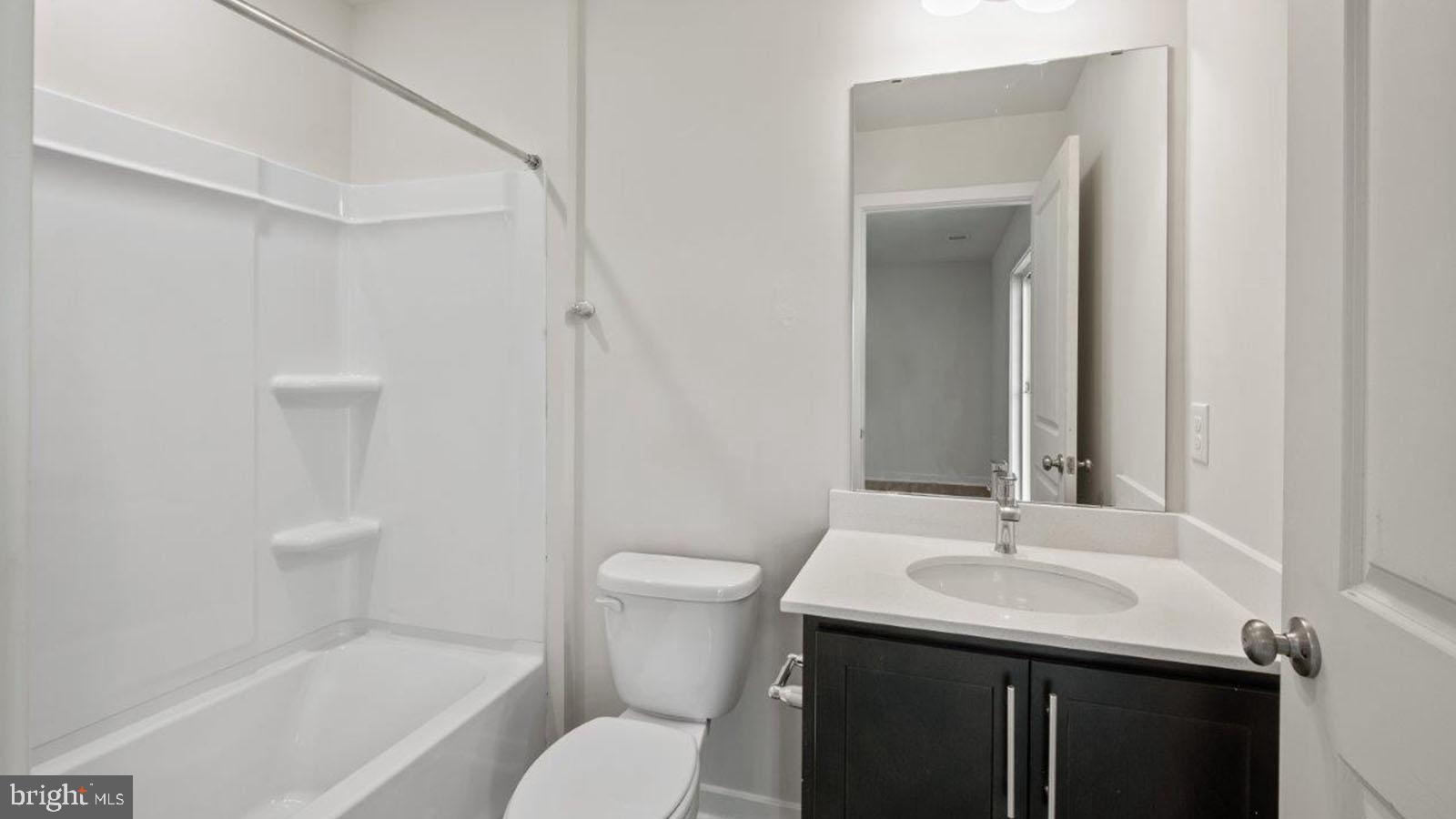 7521 Silver Thread Way Brandywine, MD 20613 - Photo 22 of 39 a bathroom with a sink toilet and shower