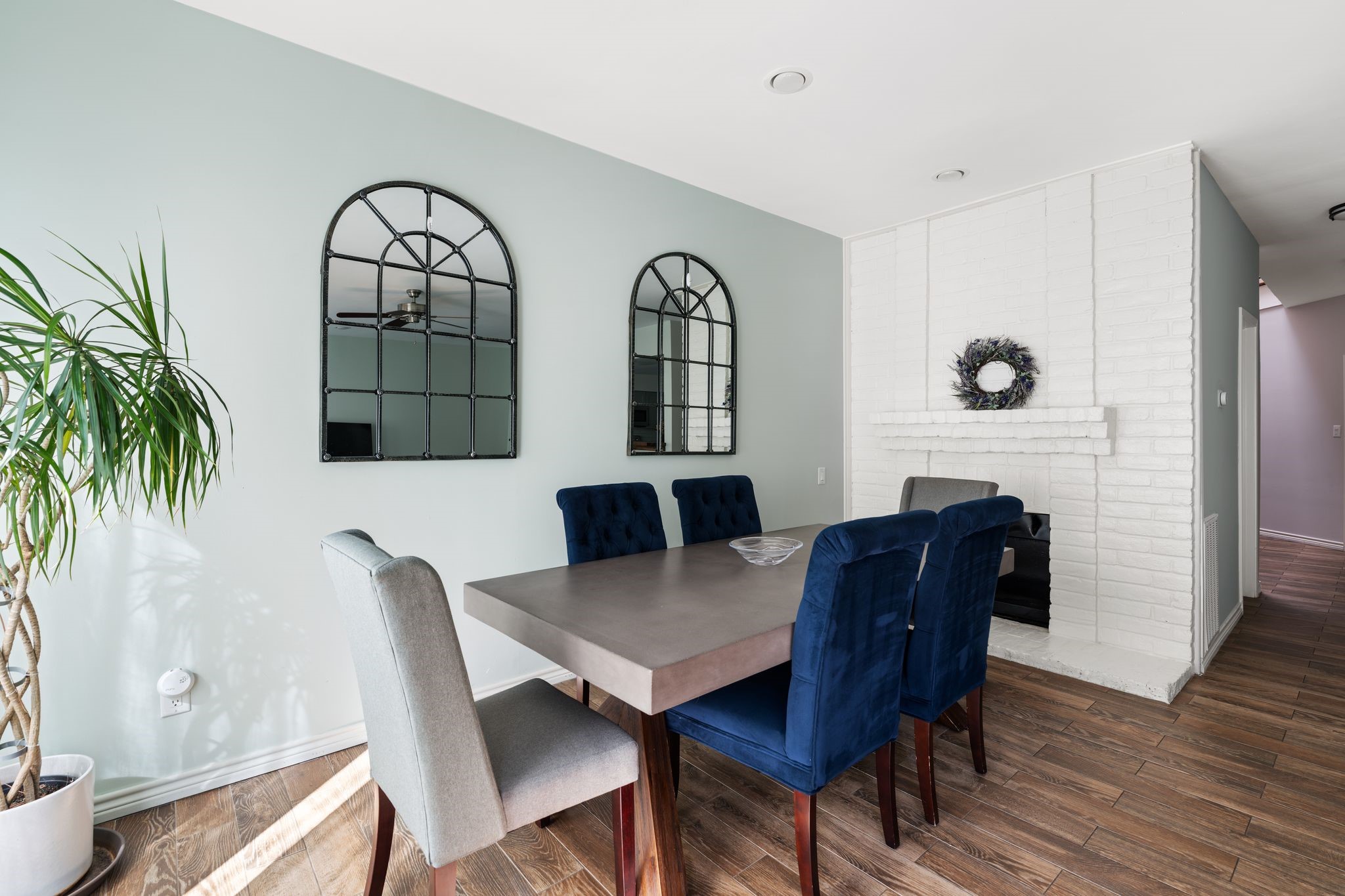 2612 Yupon Street Houston, TX 77006 - Photo 6 of 41 Wood burning brick fireplace adds warmth and character while anchoring the open living and dining layout.