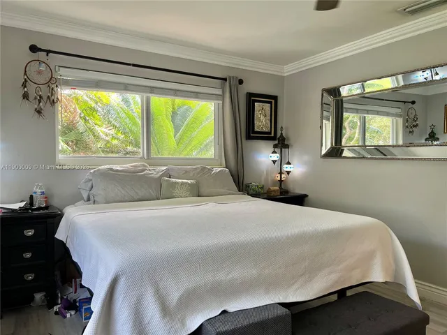 a kitchen with stainless steel appliances granite countertop a table chairs sink refrigerator and stove