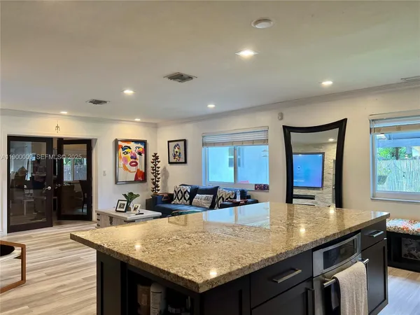 a kitchen with a refrigerator and cabinets