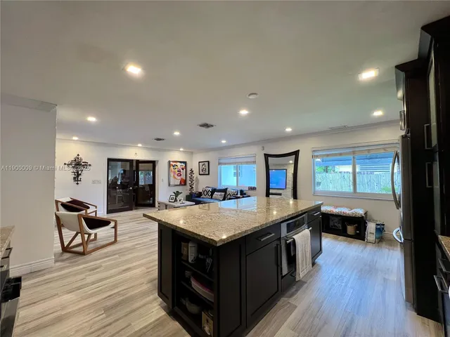 a kitchen with a sink and a microwave