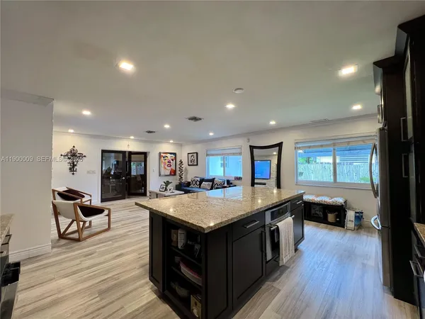 a kitchen with a sink and a microwave